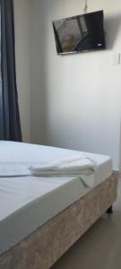 a close up of a bed in a room at Hotel Almirante Padilla in Ríohacha +47 photos