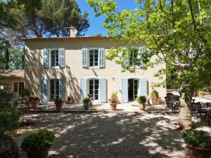 an exterior view of a white house with trees at LS7-468 - Eicela in Saint-Antonin-sur-Bayons