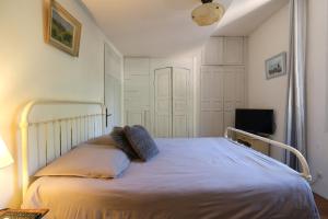a bedroom with a white bed with two pillows at LS7-468 - Eicela in Saint-Antonin-sur-Bayons +54 photos