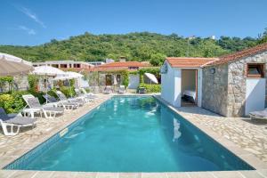 a swimming pool in a villa with a resort at Hotel Opera Jaz in Budva