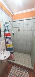 a bathroom with a shower and a sink at Rancho Amigos Columbias Caldera in Esparza +2 photos