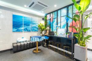 a barbershop with a couch and a table at Stay JADE in Seoul +49 photos