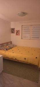 a bedroom with two beds with yellow sheets at Kod kapetana in Smederevo +41 photos