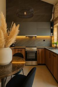 a kitchen with a table and a stove at ArKa in Chania +15 photos