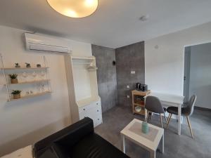 a living room with a couch and a table at Ferienhäuschen mit Wellnessbereich in Marsberg