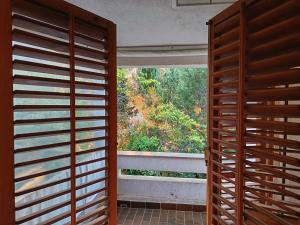 a room with a window with a view at Pine Breeze in Punat