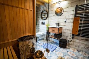 a bathroom with a sink and a toilet in a room at Ranczo Lanckorona in Kalwaria Zebrzydowska +88 photos