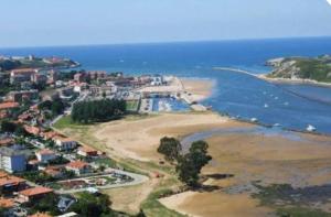 an aerial view of a beach next to the ocean at Apartamento Sol in Suances +2 photos