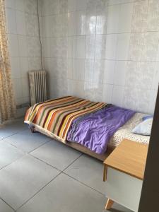 a bed sitting on the floor in a room at Hôtel Agriculture in Tunis