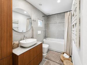 a bathroom with a sink and a toilet and a mirror at Retiro São Pedro House in Aldeia da Mata +36 photos