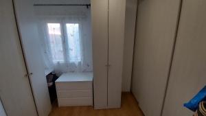 a small room with a window and a dresser at DANAGUEST in Los Llanos de Aridane +2 photos