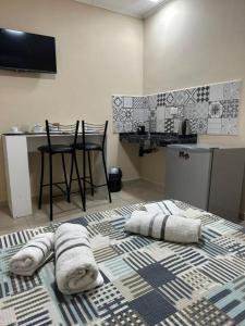 a kitchen with towels on the floor of a room at Hotel Don Luis in Paso de los Libres