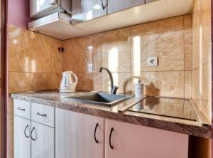a kitchen with a sink and a counter at Villa Marković 2 in Sutomore +29 photos