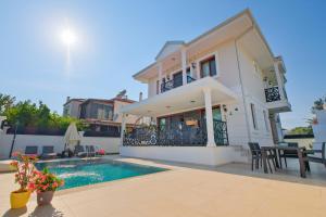a villa with a swimming pool and a house at Villa Lost dalaman in Çakallık