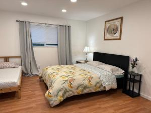 a bedroom with a bed and a window at BM master suite in Mountain View in Mountain View