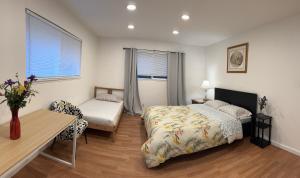 a bedroom with a bed and a desk and a table at BM master suite in Mountain View in Mountain View