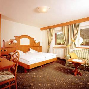 Postel nebo postele na pokoji v ubytování Hotel Scoiattolo
