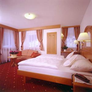 Krevet ili kreveti u jedinici u okviru objekta Hotel Scoiattolo