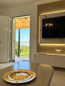 a dining room with a table with a plate on it at Villa Joel in Kefallonia