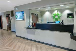 a lobby with a cash counter in a hospital at Extended Stay America Suites - Long Island - Bethpage in Bethpage