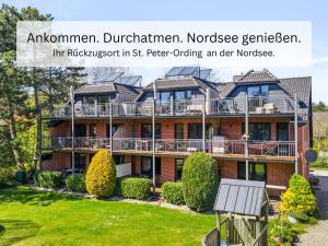 anterior view of an apartment building at Ferienwohnung Wieben Sankt Peter-Ording in Böhl +125 photos
