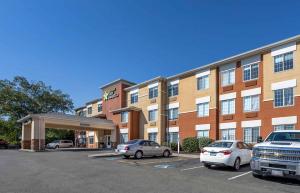 a parking lot in front of a hotel with cars parked at Extended Stay America Suites - Norwalk - Stamford in Norwalk