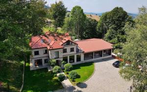 an aerial view of a house with a red roof at Rajacki konaci in Polom