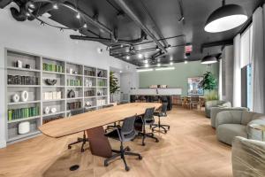 an office with a large wooden table and chairs at The York Suite Miami in Miami +72 photos