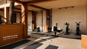 a gym with exercise equipment in a building at Puerta Vieja Hostel in San Cristóbal de Las Casas