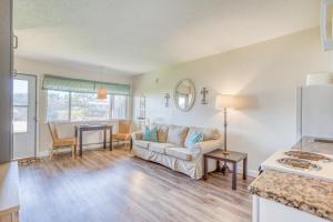 a living room with a couch and a table at Neskowin Resort 114 in Neskowin +17 photos