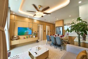 a dining room with a table and chairs at The Pathway Condotel in Sầm Sơn