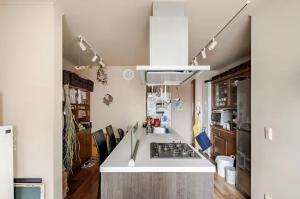 a kitchen with a sink and a stove top oven at Kasumi-an in Kumamoto