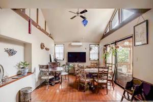 a living room with a table and a dining room at Kasumi-an in Kumamoto