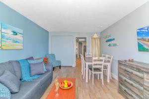 a living room with a couch and a table at Boardwalk 1139 & 1140 in Myrtle Beach