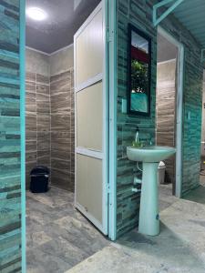 a bathroom with a sink and a mirror at El Chaparral in Yopal +17 photos