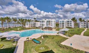an aerial view of a pool at a resort at Beachfront Luxury Condo PGA Ocean View 4BR in Boca del Soco