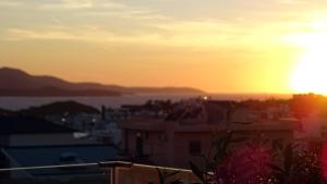 a view of the sunset from a city at Valmar Hotel in Ksamil +171 photos