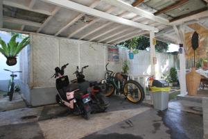 a group of motorcycles parked in a garage at New Balengku Dua Hotel - Adults Only in Gili Islands