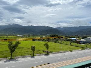 a view of a road with mountains in the background at Green Home in Yuli