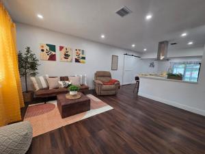 a living room with a couch and a table at Varadero Magical Scape in Miami