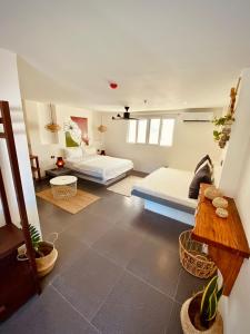 a bedroom with two beds in a room at Happiness Hostel Boracay in Boracay