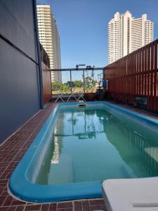 a swimming pool on the roof of a building at Baan der Bruyn in Jomtien Beach