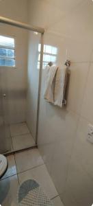 a bathroom with a shower and a toilet at Apartamentos-3-6-8-Pousada Itapetininga in Itapetininga +21 photos