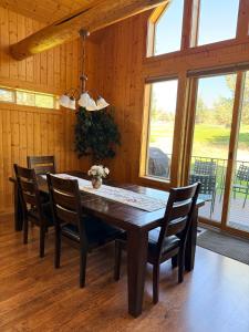 a dining room with a wooden table and chairs at 19th Hole Chalet at Eagle Crest in Redmond
