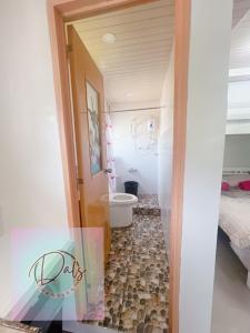 a bathroom with a tub and a toilet in a room at Dals Accommodation pad in Baguio