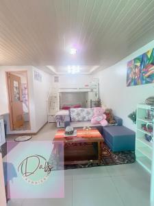 a living room with a couch and a table at Dals Accommodation pad in Baguio