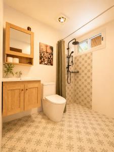 a bathroom with a toilet and a sink and a shower at Phangan Chalet Bungalows in Chaloklum +19 photos