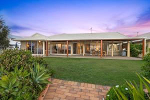 an image of a house with a yard at Whale Song House in Bargara