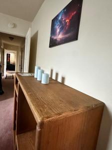 a wooden table with white candles on top of it at Sacred Heart House in Montebello
