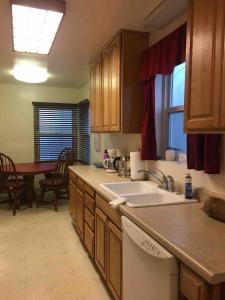a kitchen with a sink and a counter top at Sacred Heart House in Montebello +36 photos